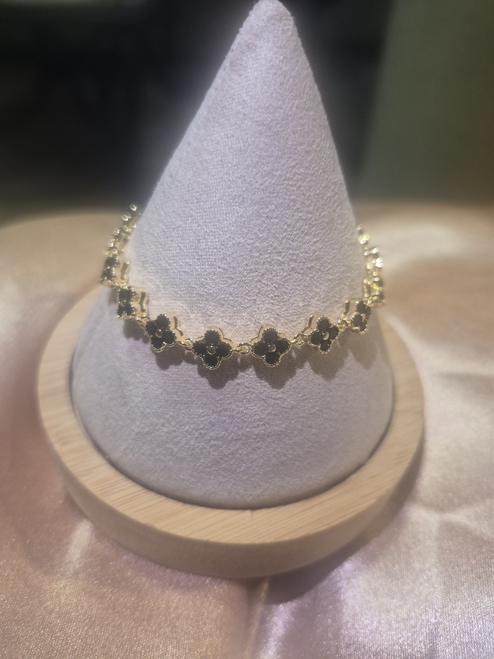 Gold-Plated Bracelet with Black Flower Accents